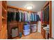Spacious walk-in closet with custom wood shelving and ample storage for clothing and personal items at 2937 S Atlantic Ave # 1907, Daytona Beach Shores, FL 32118