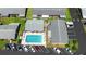 Aerial shot of community pool with lounge chairs, surrounded by well-maintained landscaping and parking at 3 Fairway Ct, Deland, FL 32724