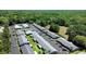 Drone shot of the condo complex displaying lush greenery and manicured landscapes at 3 Fairway Ct, Deland, FL 32724