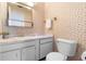 Small bathroom features wallpaper, a single sink vanity, and a toilet at 3 Fairway Ct, Deland, FL 32724