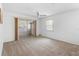 Bedroom boasts carpet floors, sliding glass doors, a ceiling fan, and a window at 3 Fairway Ct, Deland, FL 32724