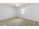 Cozy bedroom with beige carpet, a ceiling fan, and bright window at 3 Fairway Ct, Deland, FL 32724