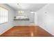 Open-concept dining area showcasing views into kitchen, adjacent to a warm interior at 3 Fairway Ct, Deland, FL 32724