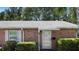 Charming brick home featuring a well-maintained front entrance and established landscaping at 3 Fairway Ct, Deland, FL 32724