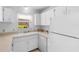 Well-lit kitchen featuring bright cabinets and modern appliances at 3 Fairway Ct, Deland, FL 32724