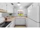Efficient kitchen features bright cabinetry and ample counter space at 3 Fairway Ct, Deland, FL 32724