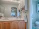 Bathroom with double sinks, cabinets, and views into main bedroom at 307 Stonington Way, Deland, FL 32724