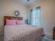 Cozy bedroom with a comfortable bed, bright window, and charming decor for a relaxing atmosphere at 307 Stonington Way, Deland, FL 32724