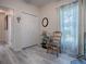 Inviting bonus room with storage shelves, a decorative mirror, and a large window for brightness at 307 Stonington Way, Deland, FL 32724