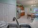 Kitchen featuring stainless steel refrigerator, tile flooring, and updated cabinets at 307 Stonington Way, Deland, FL 32724