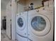 Modern laundry room equipped with a washer and dryer, providing convenience for laundry tasks at 307 Stonington Way, Deland, FL 32724
