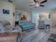 Open floor plan living room with wood floors and plenty of seating at 307 Stonington Way, Deland, FL 32724