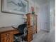 Functional office space with a wooden desk and cabinet, perfect for working from home in an organized setting at 307 Stonington Way, Deland, FL 32724