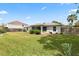Well-maintained backyard featuring a privacy fence and green lawn at 3214 Juniper Dr, Edgewater, FL 32141