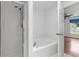 Bathroom features a tub, and shower at 3214 Juniper Dr, Edgewater, FL 32141