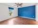 Bedroom with laminate flooring and a large window at 3214 Juniper Dr, Edgewater, FL 32141
