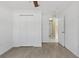 Spacious bedroom with ceiling fan, laminate floors and a large closet at 3214 Juniper Dr, Edgewater, FL 32141