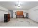 Two car garage featuring a workbench, cabinets, and water heater at 3214 Juniper Dr, Edgewater, FL 32141