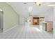 Open-concept living room with tile floors and sliding glass doors to the patio, creating a seamless indoor/outdoor flow at 3214 Juniper Dr, Edgewater, FL 32141