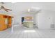 Open-concept living room with tile flooring, and a breakfast bar at 3214 Juniper Dr, Edgewater, FL 32141