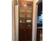 Built-in hallway cabinet with glass doors and visible storage at 326 South St, De Leon Springs, FL 32130
