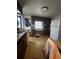 Modest kitchen featuring wood cabinets and essential appliances at 326 South St, De Leon Springs, FL 32130