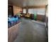 Spacious living area with wood paneling and abundant natural light at 326 South St, De Leon Springs, FL 32130