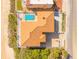 Aerial view of house with terracotta roof and beautiful pool near sandy beach at 33 Ocean Shore Blvd, Ormond Beach, FL 32176
