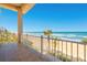 Balcony with ocean views, overlooking the beach and palm trees at 33 Ocean Shore Blvd, Ormond Beach, FL 32176