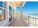 Balcony with stunning ocean views, tiled floor, and white railings at 33 Ocean Shore Blvd, Ormond Beach, FL 32176