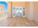 Large balcony with tile floor, white trim and glass doors at 33 Ocean Shore Blvd, Ormond Beach, FL 32176
