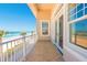 Balcony overlooking the ocean, framed by beachside palm trees, offering a serene retreat at 33 Ocean Shore Blvd, Ormond Beach, FL 32176