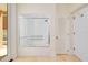 Clean bathroom featuring an accessible shower/tub combination with grab bars and a sliding glass door at 33 Ocean Shore Blvd, Ormond Beach, FL 32176