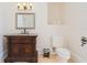 Bathroom featuring granite vanity and traditional-style fixtures, adding to the room's charm at 33 Ocean Shore Blvd, Ormond Beach, FL 32176
