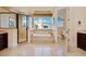 Spacious bathroom featuring walk-in shower, soaking tub, dual vanity, and beach views at 33 Ocean Shore Blvd, Ormond Beach, FL 32176
