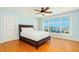 Bedroom featuring wood floors, ceiling fan and water views at 33 Ocean Shore Blvd, Ormond Beach, FL 32176