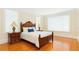 Comfortable bedroom with wood floors, bedside tables, and large windows for natural light at 33 Ocean Shore Blvd, Ormond Beach, FL 32176