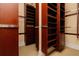 Large walk-in closet with built-in shelving and custom organization system at 33 Ocean Shore Blvd, Ormond Beach, FL 32176