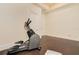 Well-lit exercise room with an elliptical machine, offering a great space for workouts at 33 Ocean Shore Blvd, Ormond Beach, FL 32176
