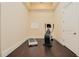 Bright exercise room with wood floors, an elliptical machine, and a treadmill at 33 Ocean Shore Blvd, Ormond Beach, FL 32176
