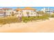 Elegant home with direct beach access, surrounded by lush landscaping and offering a serene coastal lifestyle at 33 Ocean Shore Blvd, Ormond Beach, FL 32176