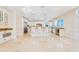 Spacious kitchen with white cabinetry, granite countertops, and stainless steel appliances at 33 Ocean Shore Blvd, Ormond Beach, FL 32176