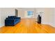 Bright living room with a decorative fireplace, hardwood floors, and ocean views at 33 Ocean Shore Blvd, Ormond Beach, FL 32176