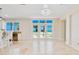 Bright living area with tile flooring, modern lighting, and a beautiful view of the beach at 33 Ocean Shore Blvd, Ormond Beach, FL 32176