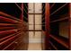 Spacious walk-in closet with custom wood shelving and ample storage space for clothes and accessories at 33 Ocean Shore Blvd, Ormond Beach, FL 32176