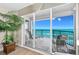 Relaxing balcony with seating overlooking the ocean and beachfront, with sliding glass doors offering ample natural light at 3311 S Atlantic Ave # 1704, Daytona Beach Shores, FL 32118