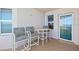 Cozy balcony space with cushioned seating, perfect for relaxation and enjoying the fresh air at 3311 S Atlantic Ave # 1704, Daytona Beach Shores, FL 32118