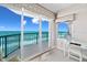 Bedroom featuring a vanity and desk, overlooking a balcony with ocean view at 3311 S Atlantic Ave # 1704, Daytona Beach Shores, FL 32118