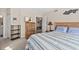 Welcoming bedroom with a striped bed and view into ensuite bathroom, perfect for relaxing and unwinding at 3311 S Atlantic Ave # 1704, Daytona Beach Shores, FL 32118