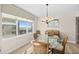 Elegant dining area with a glass table and window views, perfect for enjoying meals with a view at 3311 S Atlantic Ave # 1704, Daytona Beach Shores, FL 32118